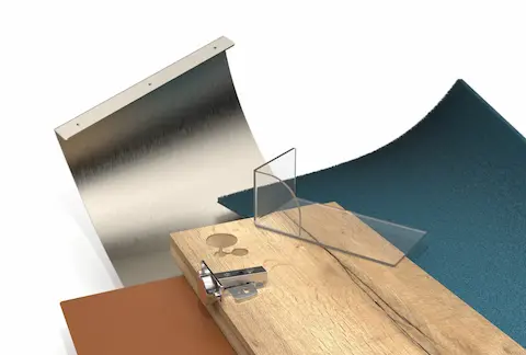 Render IronCAD Render gemaakt in IronCAD van diverse interieurmaterialen op een vlak oppervlak, waaronder een houten paneel met scharnierbeslag, een metalen plaat, een stuk glas en textiel in verschillende kleuren